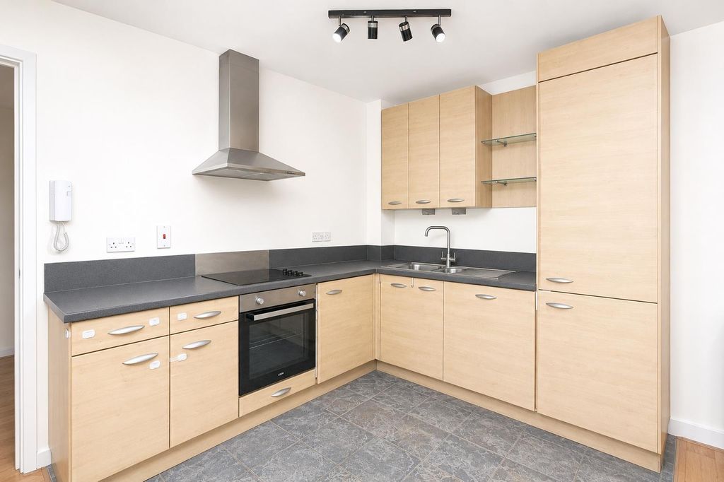 Property photo 3 of 9 Bright Modern Kitchen With Ample Storage Space...