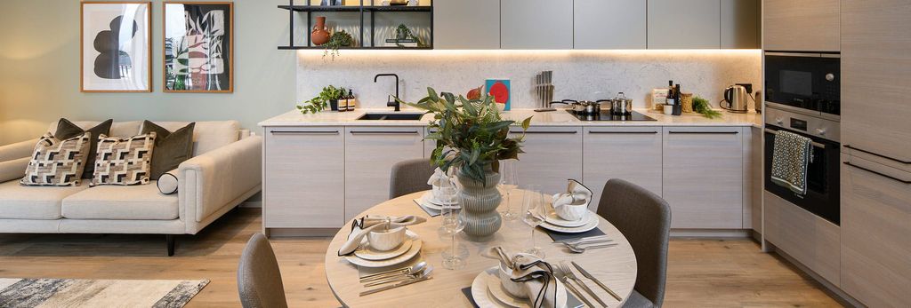 Property photo 2 of 5 Closeup Of Dining Table With Living Space / Kitchen In Background, Designed In Beige And White