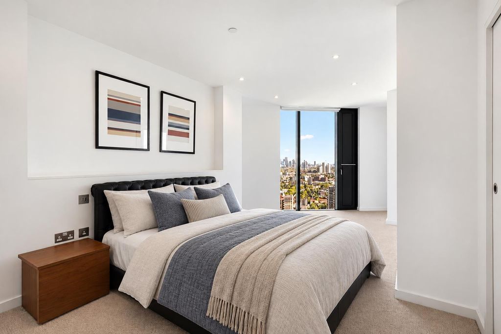 Property photo 3 of 18 Hotel-Style Bedroom With City Views.Png