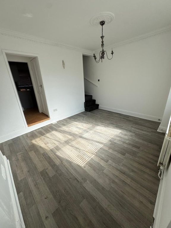 Property photo 3 of 9 Bright Living Room Featuring A Modern Wood-Style F...