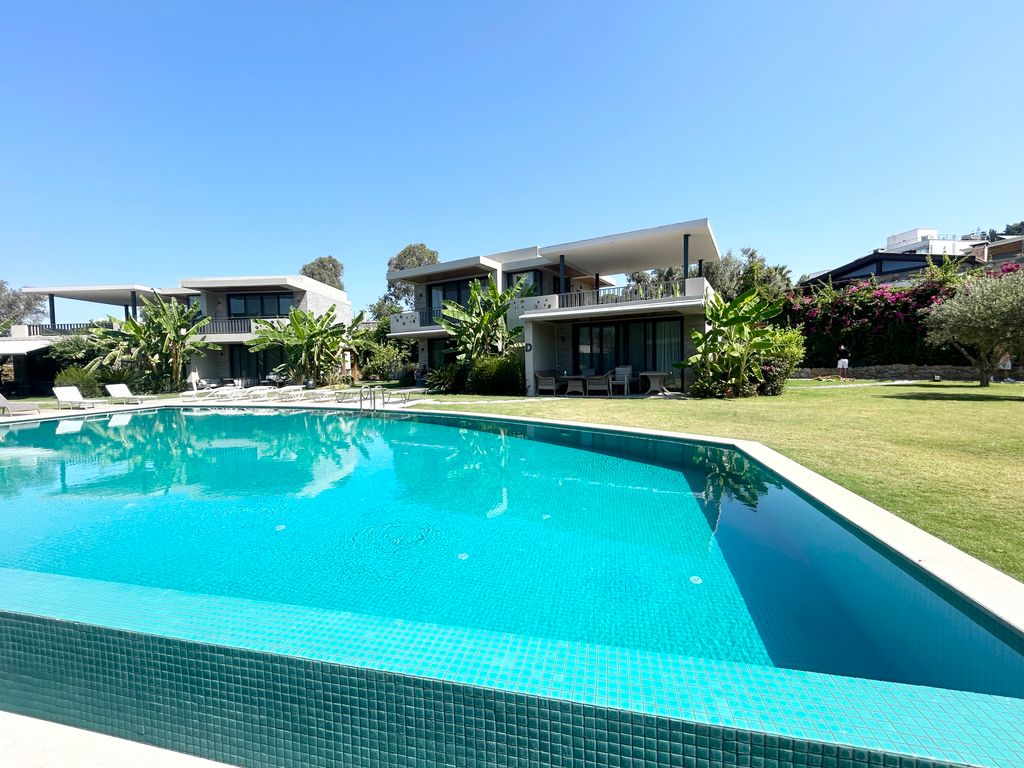 Property photo 1 of 23 An Immaculate Terrace Apartment For Sale In Bodrum - Main View Of The Apartment And Shared Pool