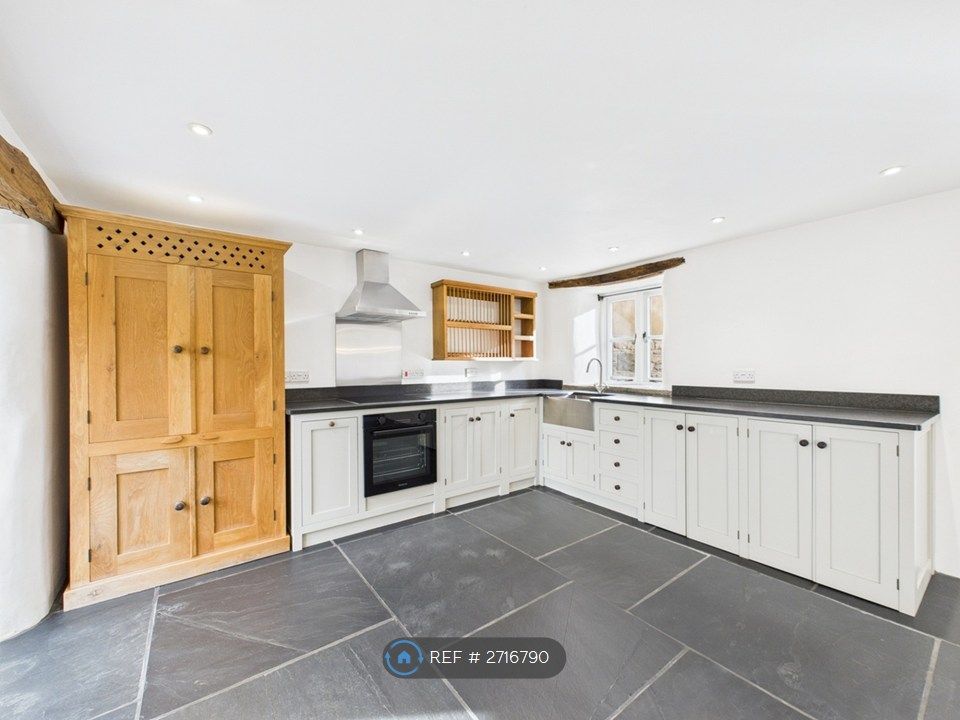 Property photo 2 of 12 Kitchen Area