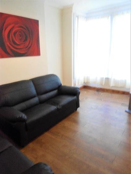 Property photo 2 of 22 A Bright And Welcoming Living Room Featuring A Mod...