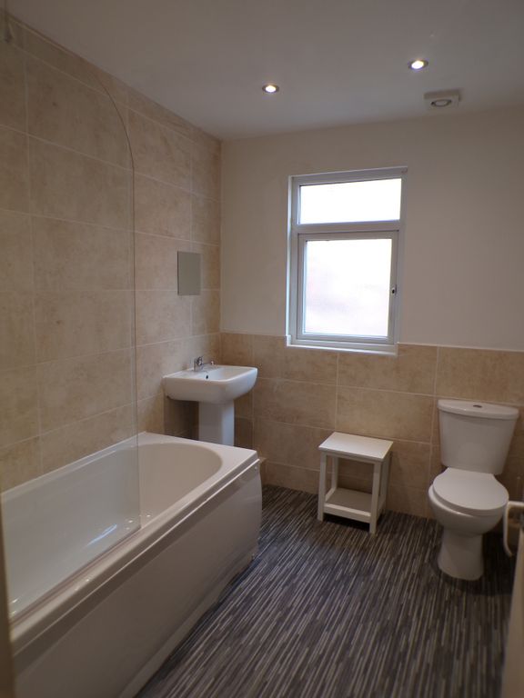 Property photo 1 of 13 A Spacious And Modern Bathroom Featuring A Relaxin...