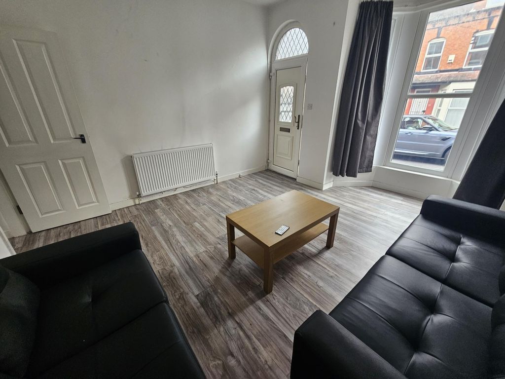 Property photo 2 of 11 A Bright And Welcoming Living Room Featuring Large...