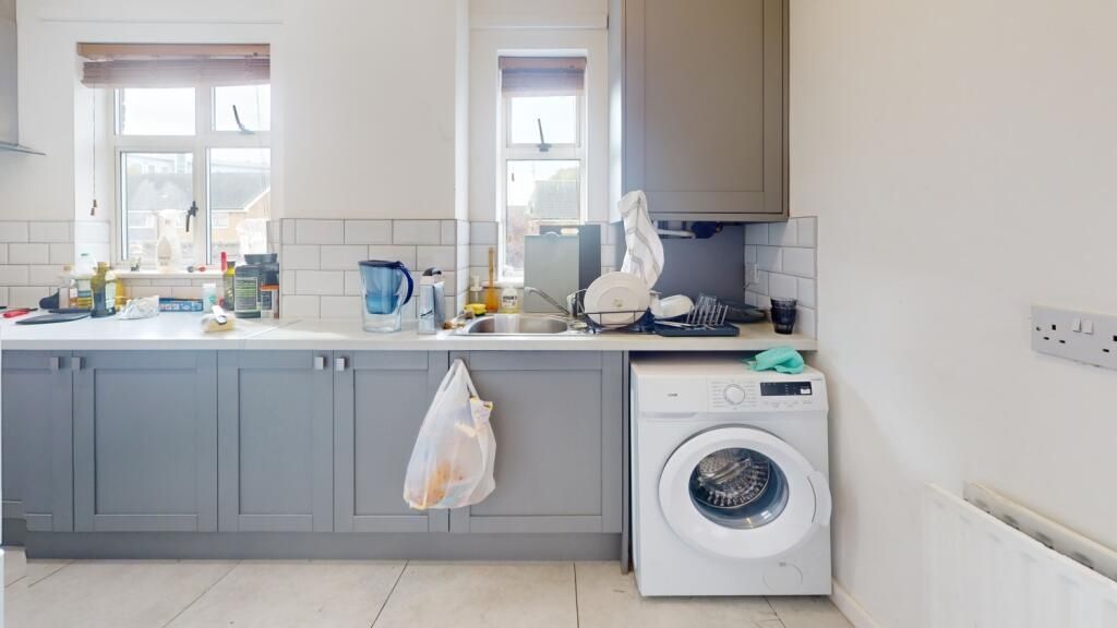 Property photo 2 of 6 Bright And Functional Kitchen Featuring Ample Coun...