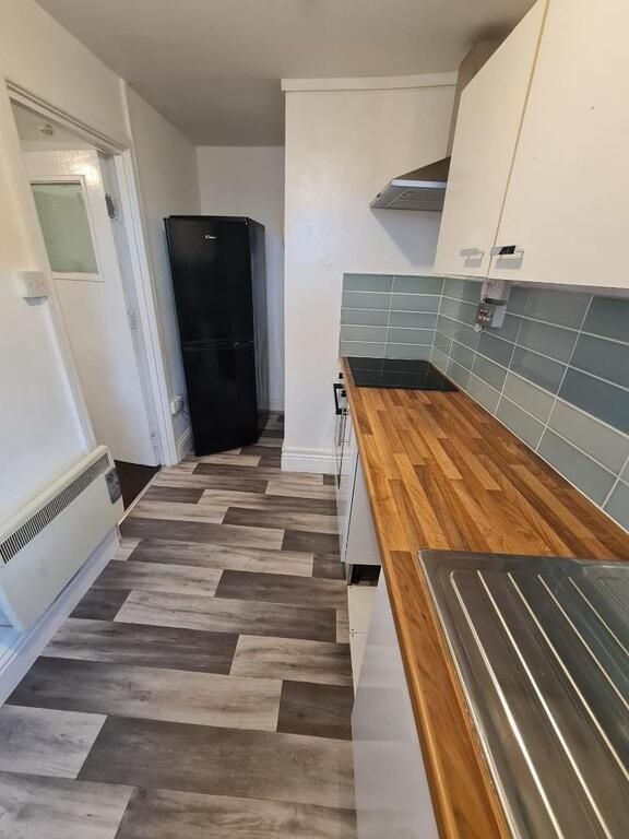 Property photo 2 of 5 Neat Galley Kitchen With Wood-Effect Worktops, Pal...