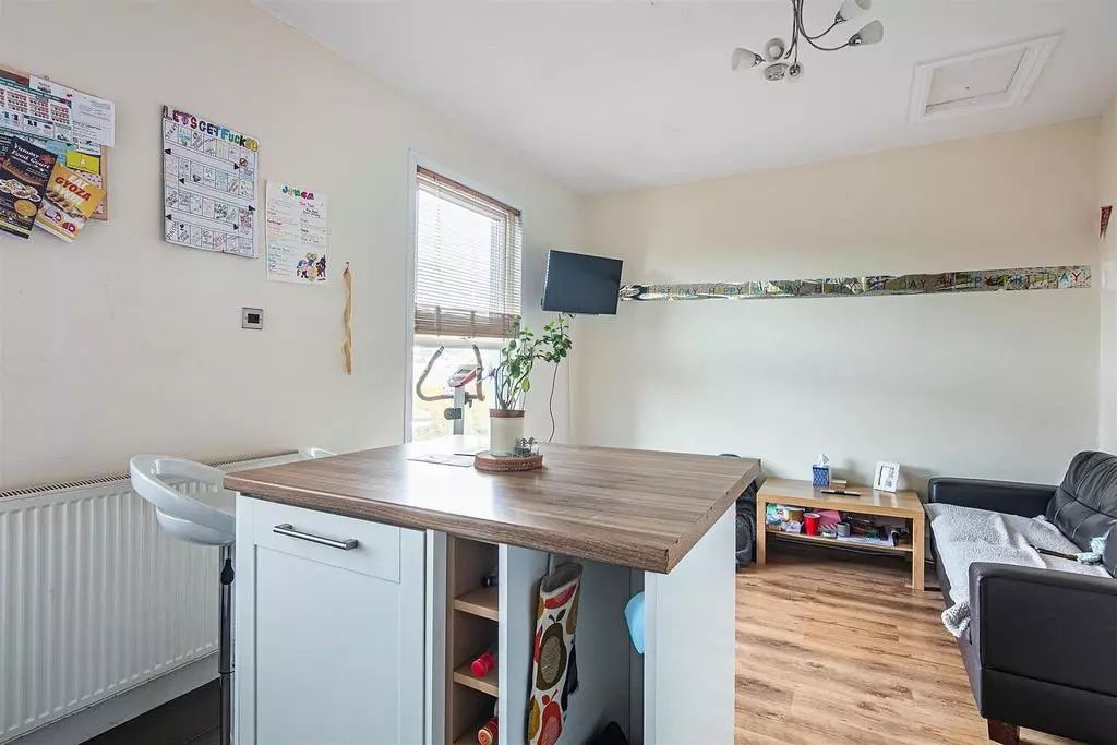 Property photo 1 of 9 Bright And Welcoming Living Room Featuring A Moder...