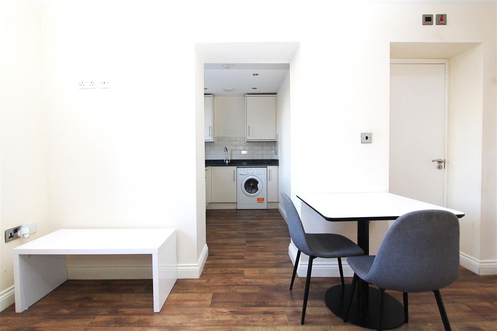 Property photo 2 of 7 Bright Open Living Area With Modern Dining Table...
