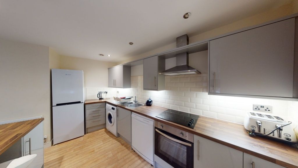 Property photo 3 of 14 Modern Kitchen Featuring Ample Countertop Space, B...