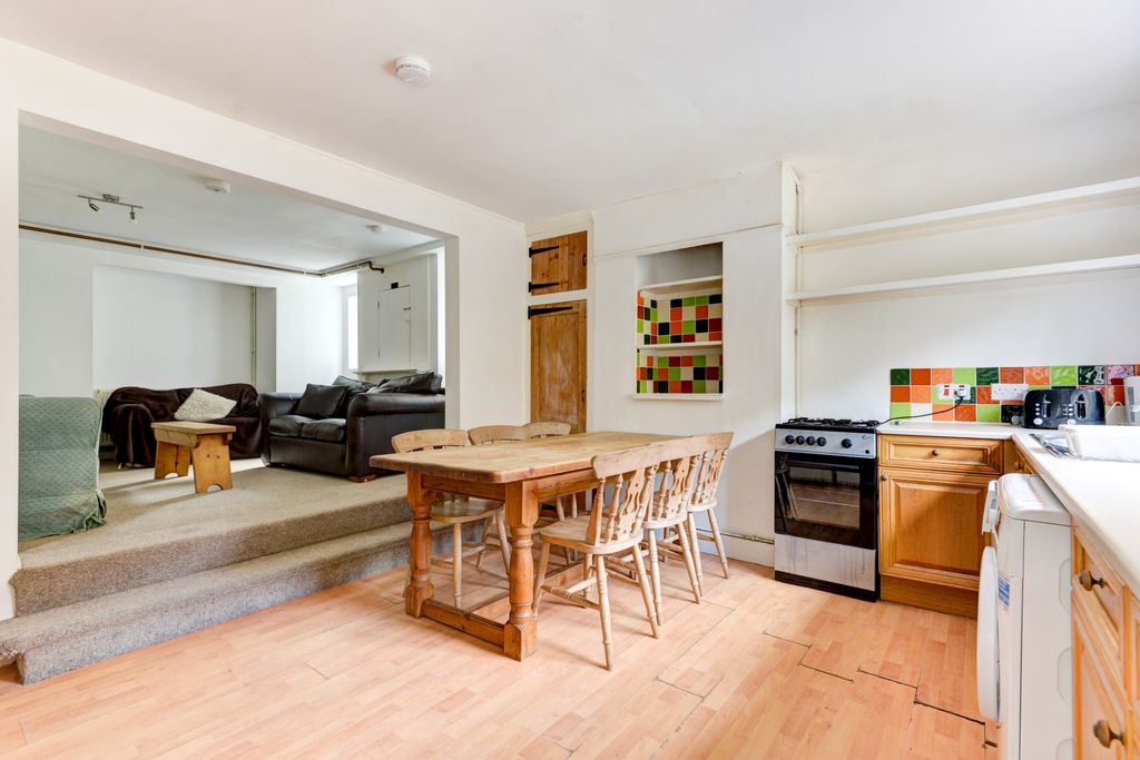 Property photo 2 of 21 A Spacious, Bright Living Room Featuring Comfortab...