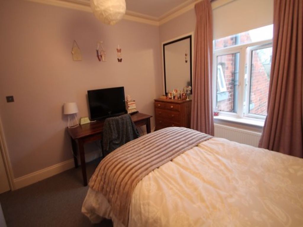 Property photo 2 of 20 A Cozy Double Bedroom Featuring A Well-Made Bed, A...