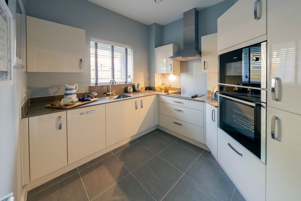 Property photo 2 of 12 Typical Kitchen