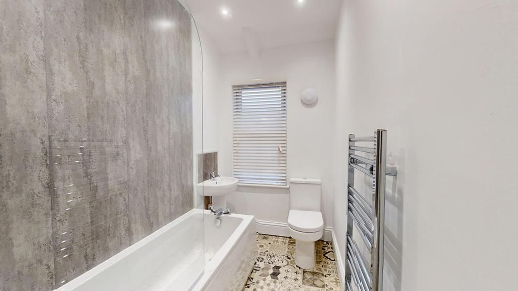 Property photo 3 of 22 A Modern And Clean Bathroom Featuring A Stylish Ba...