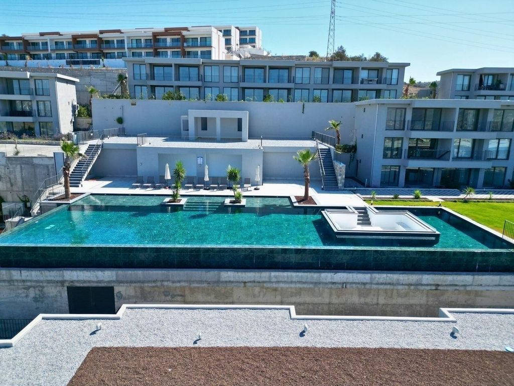 Property photo 1 of 19 A Brand New Sunset View Apartment For Sale In Milas, Dorttepe - Main View Of The Complex And Shared Pool