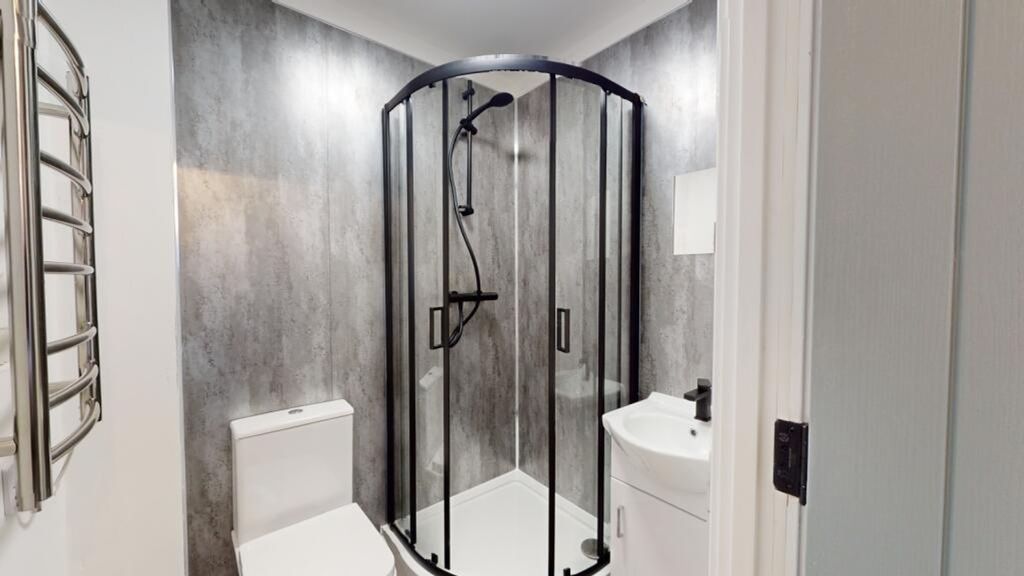 Property photo 2 of 15 A Modern And Clean Bathroom Featuring A Stylish Sh...