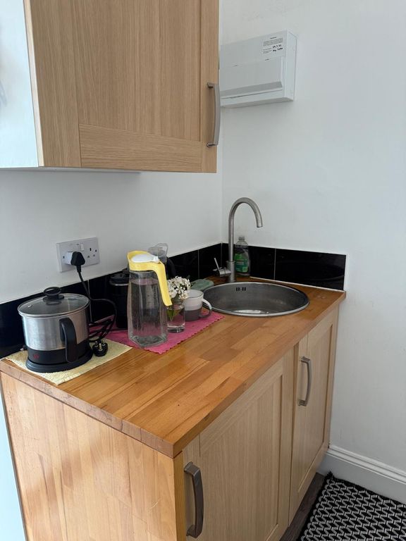 Property photo 2 of 6 Bright Kitchenette With Warm Wood Finishes...