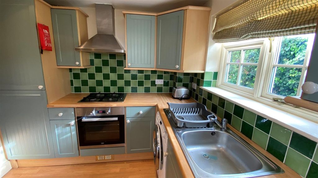 Property photo 2 of 25 Modern Kitchen With Bright Green Tiling And Window...