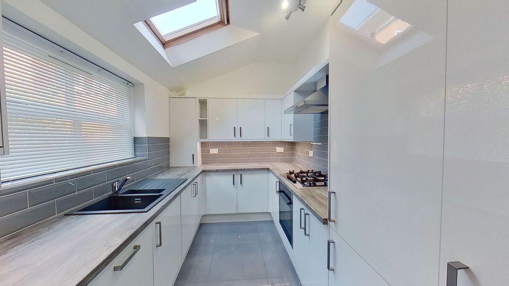 Property photo 2 of 11 Bright Modern Galley Kitchen With Gloss White Cabi...