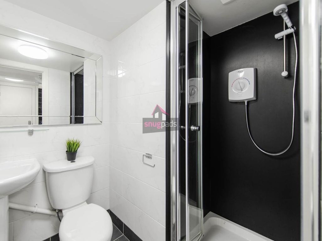 Property photo 3 of 5 Bright And Modern Bathroom Suite Featuring A Sleek...