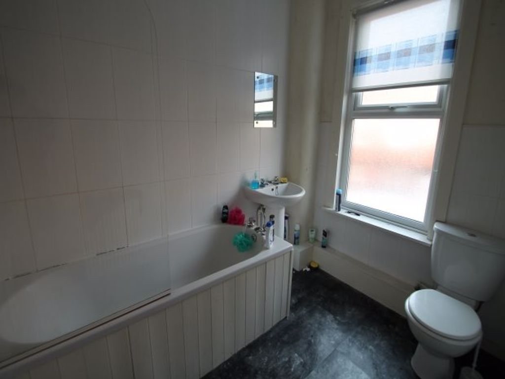 Property photo 2 of 6 A Bright And Clean Bathroom Featuring A Toilet, Wi...