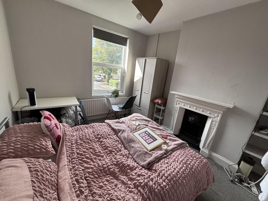 Property photo 1 of 21 A Spacious And Well-Lit Master Bedroom Featuring A...