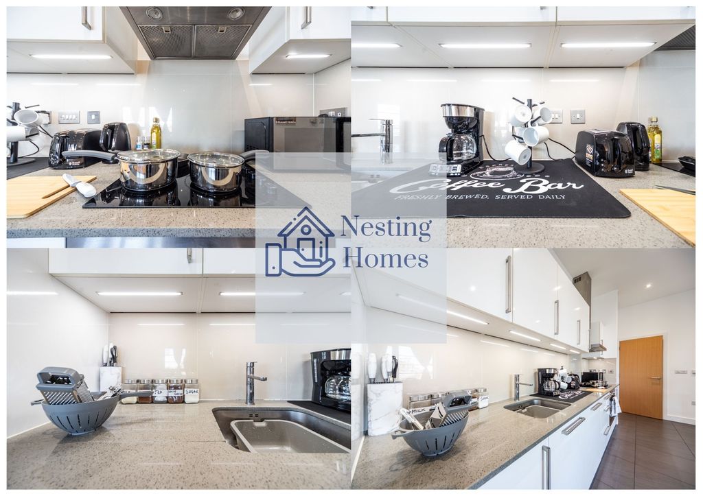 Property photo 1 of 7 A Modern, Sleek Kitchen Featuring A Polished Grey ...
