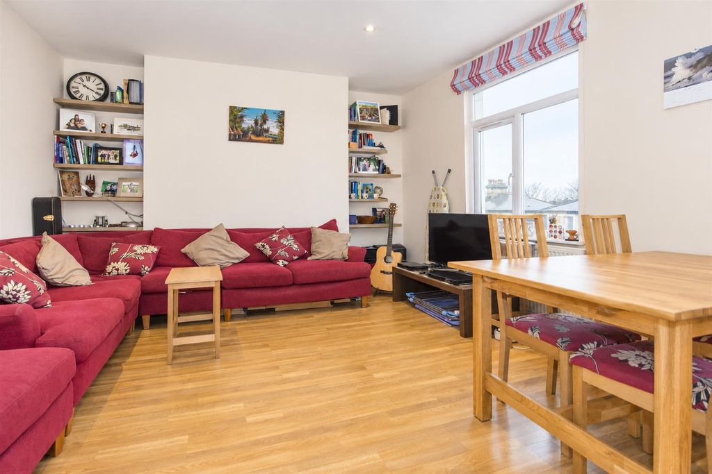 Property photo 1 of 8 Bright Red Sofa Living And Dining Room.Png