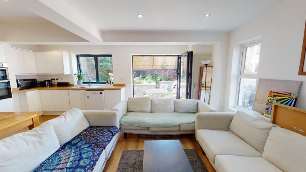 Property photo 3 of 15 Bright And Inviting Living Room Featuring A Spacio...