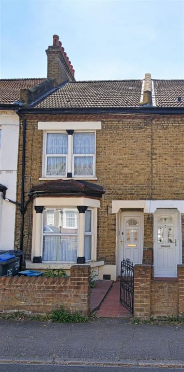 Property photo 1 of 1 Sunlit British Terraced House Facade.Png