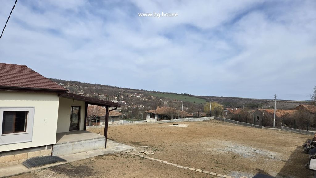 Property photo 3 of 100 View Of The House Corner And Large Fenced Yard With Village Houses And Hills In The Background