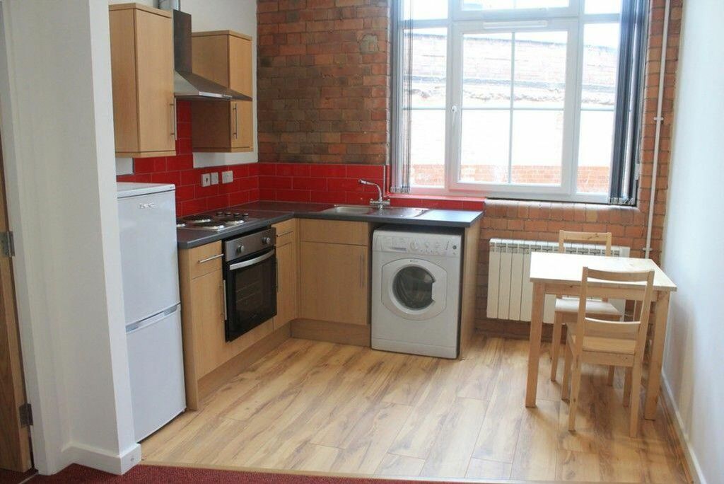 Property photo 3 of 4 Modern Kitchen Featuring A Stylish Design With Amp...