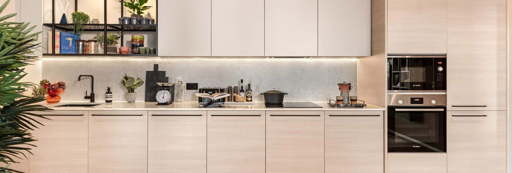 Property photo 1 of 7 Kitchen, Beige Cupboard Panels And White Countertops, Modern Appliances.