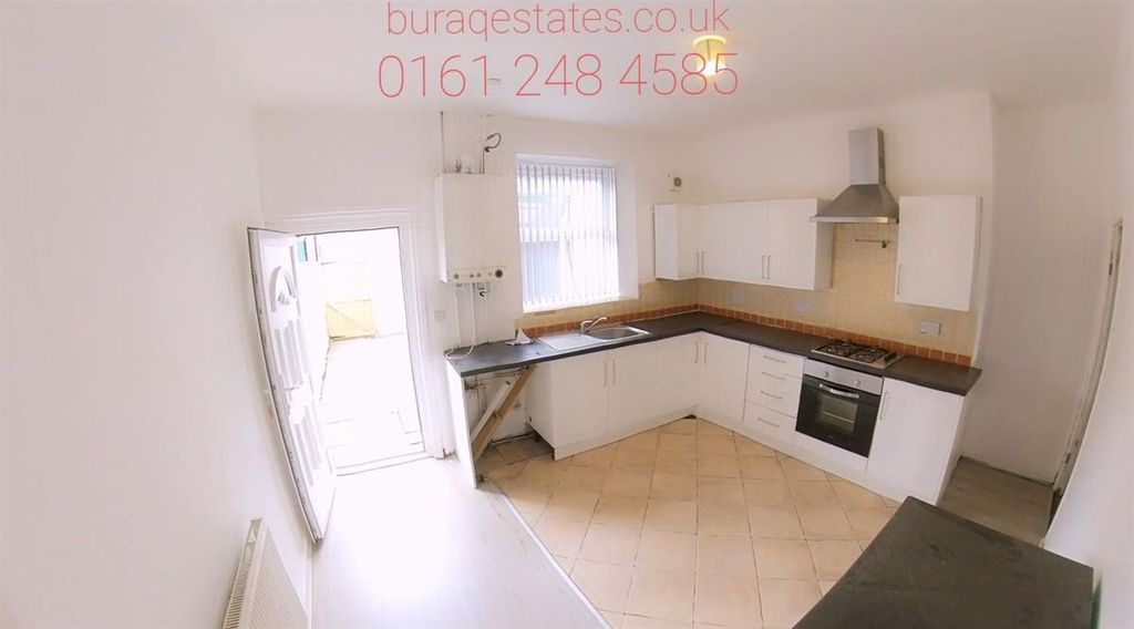 Property photo 3 of 7 Bright And Modern Kitchen Featuring Ample Natural ...