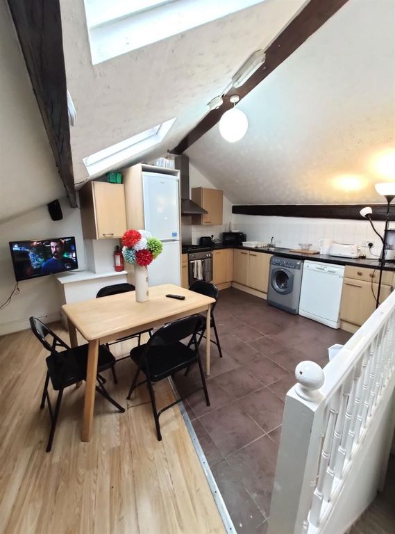 Property photo 3 of 7 Bright And Modern Kitchen With Sloped Ceilings Fea...