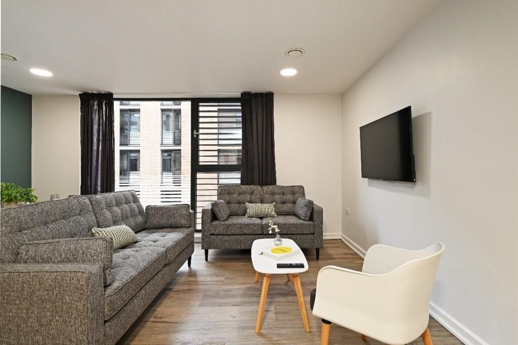 Property photo 2 of 10 A Modern And Inviting Living Room Featuring Stylis...
