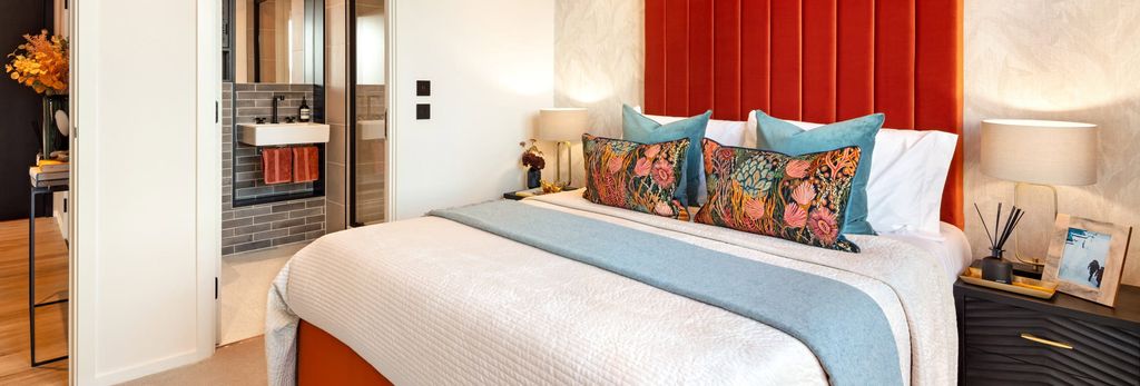 Property photo 3 of 7 Double Bed With Tall Red Headboard, Bedside Tables And Ensuite Bathroom.