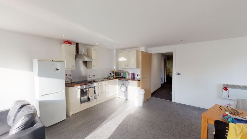 Property photo 3 of 5 Bright And Modern Kitchen Area Featuring White Cab...