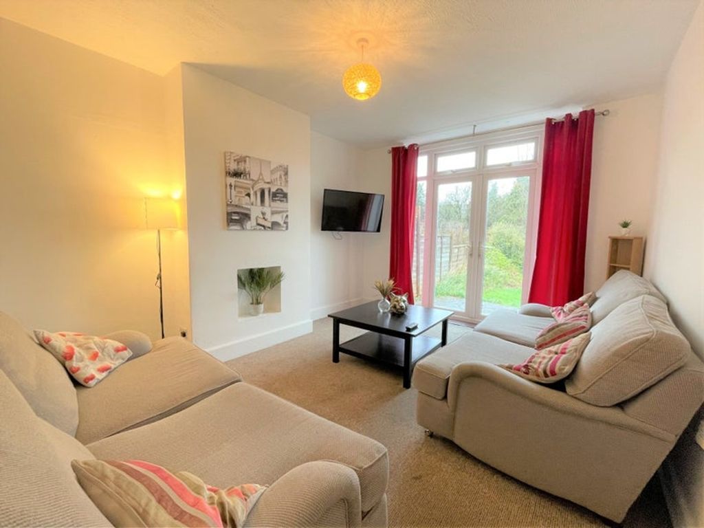 Property photo 2 of 7 Bright And Inviting Living Room Featuring Comforta...