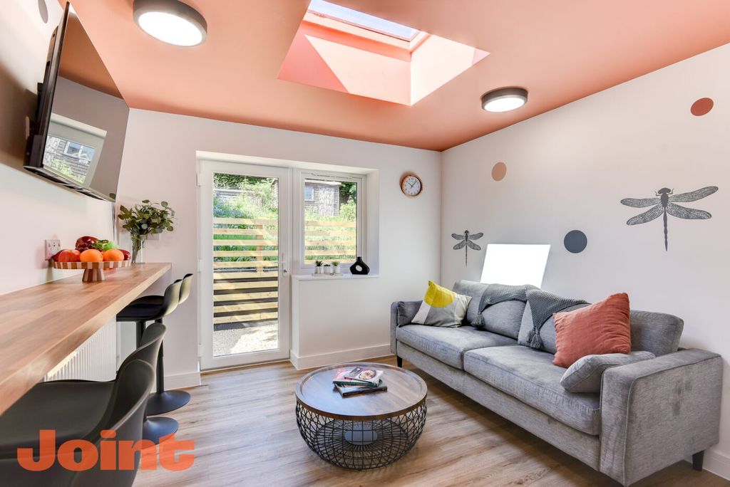 Property photo 2 of 5 Bright, Modern Living Area With A Comfortable Grey...