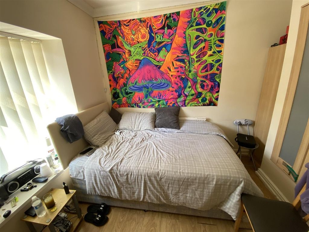Property photo 2 of 7 Bright Bedroom With Large Bed And Colorful Art...