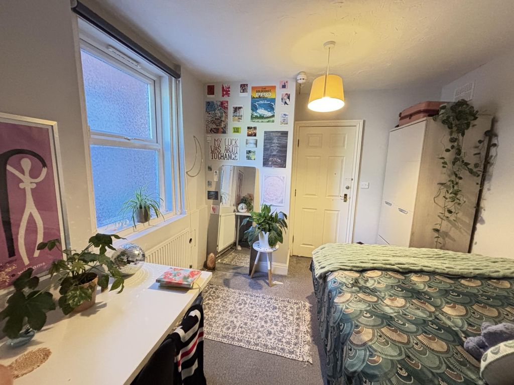 Property photo 2 of 94 A Spacious And Well-Lit Bedroom Featuring A Large ...