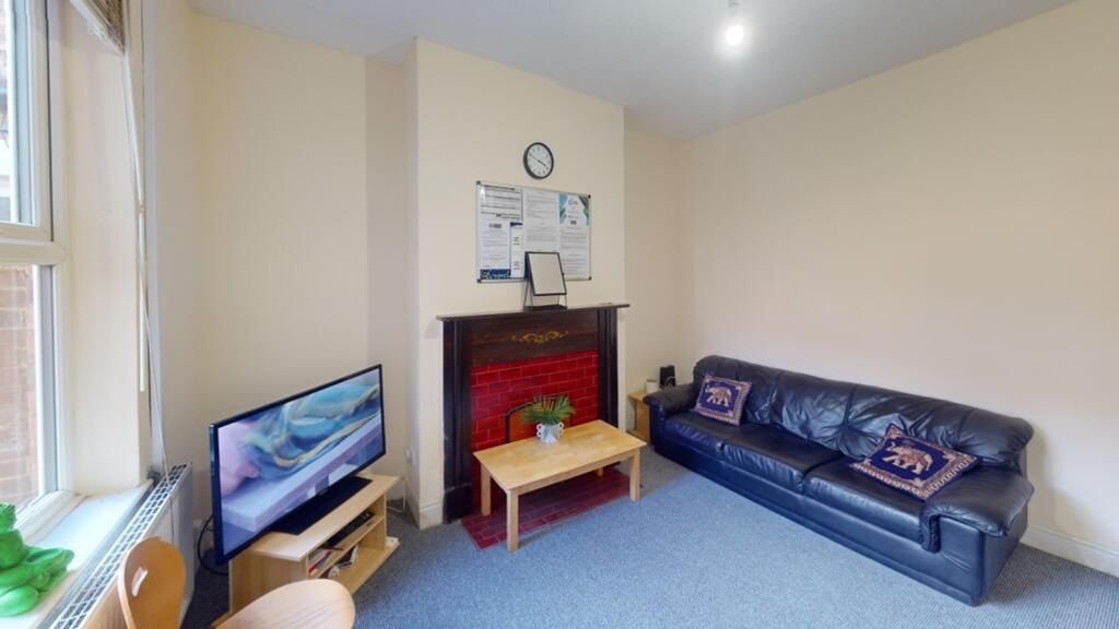 Property photo 3 of 15 A Cozy Living Room Featuring A Comfortable Leather...