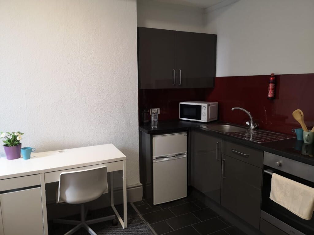 Property photo 3 of 5 Modern Kitchen Area With Integrated Study Desk...