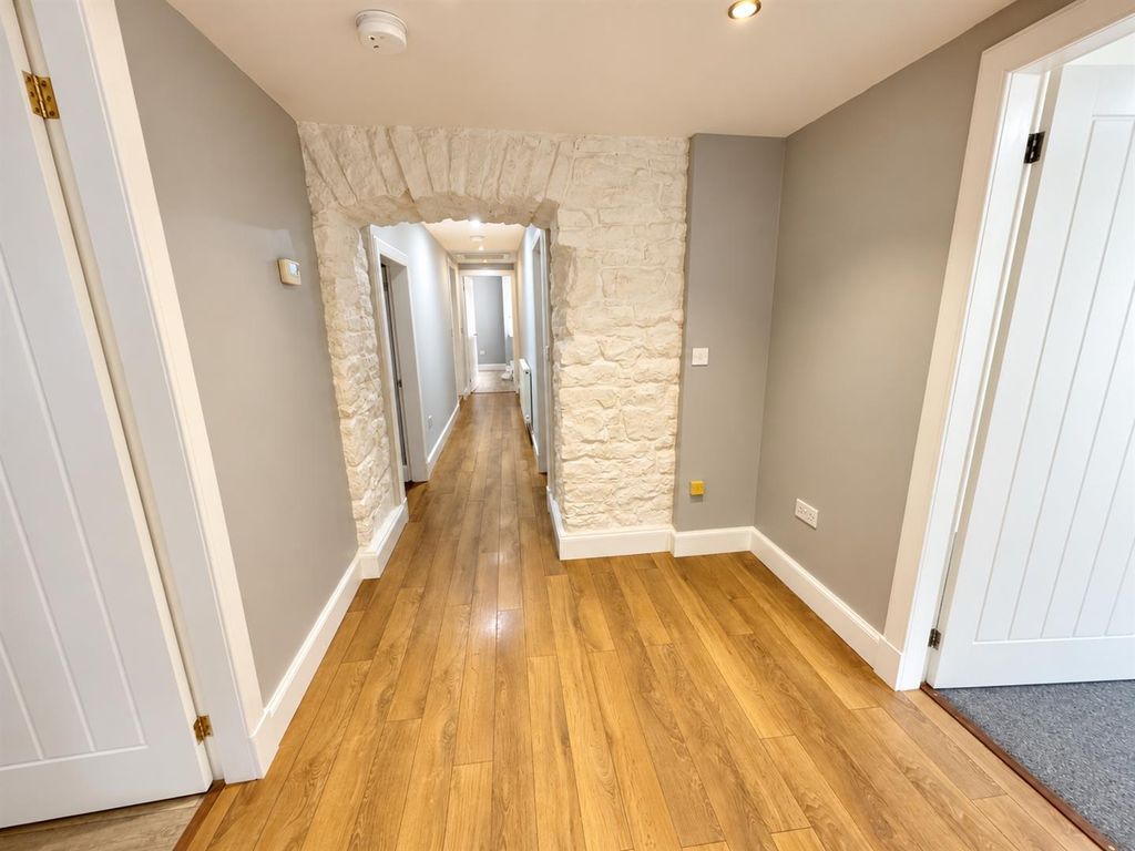 Property photo 3 of 14 Bright Stone-Arch Hallway Perspective.Png