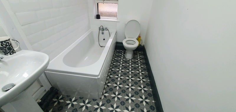 Property photo 2 of 9 A Clean, Well-Maintained Bathroom Featuring A Bath...