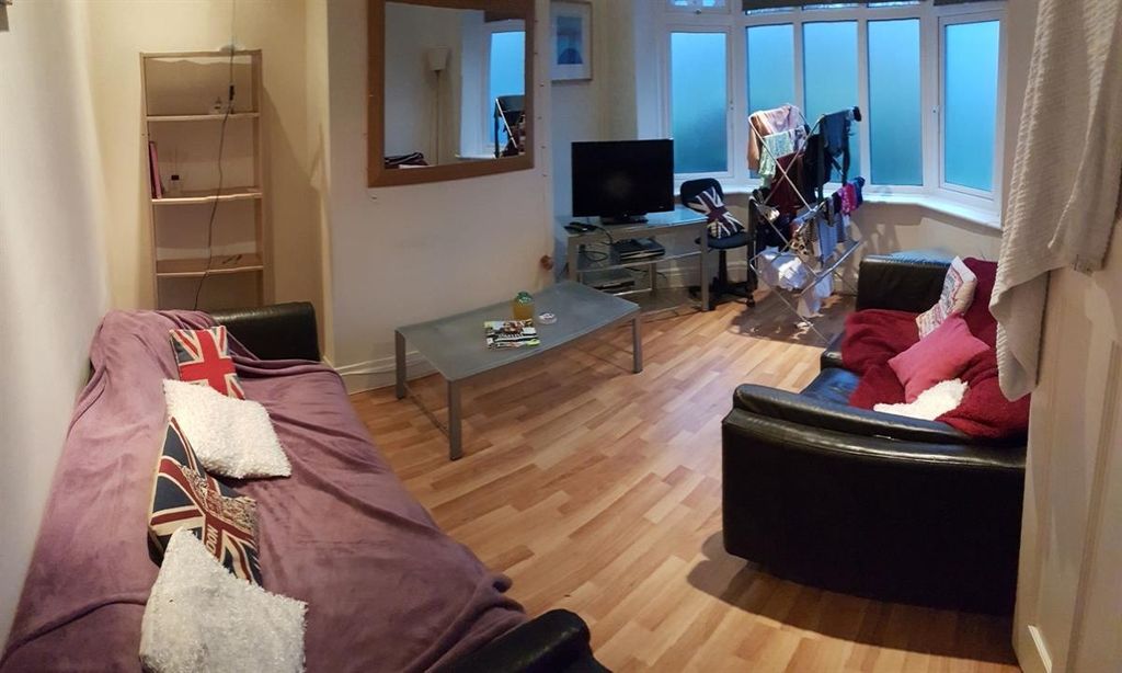 Property photo 3 of 9 Spacious And Welcoming Living Room Featuring Comfo...