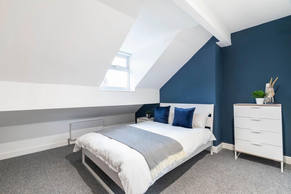 Property photo 2 of 11 A Bright And Modern Master Bedroom Featuring A Lar...