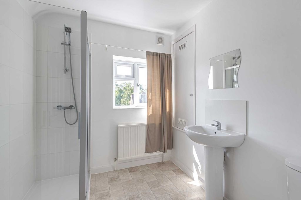 Property photo 2 of 8 Bright, Modern Bathroom With A Walk-In Shower, Ped...