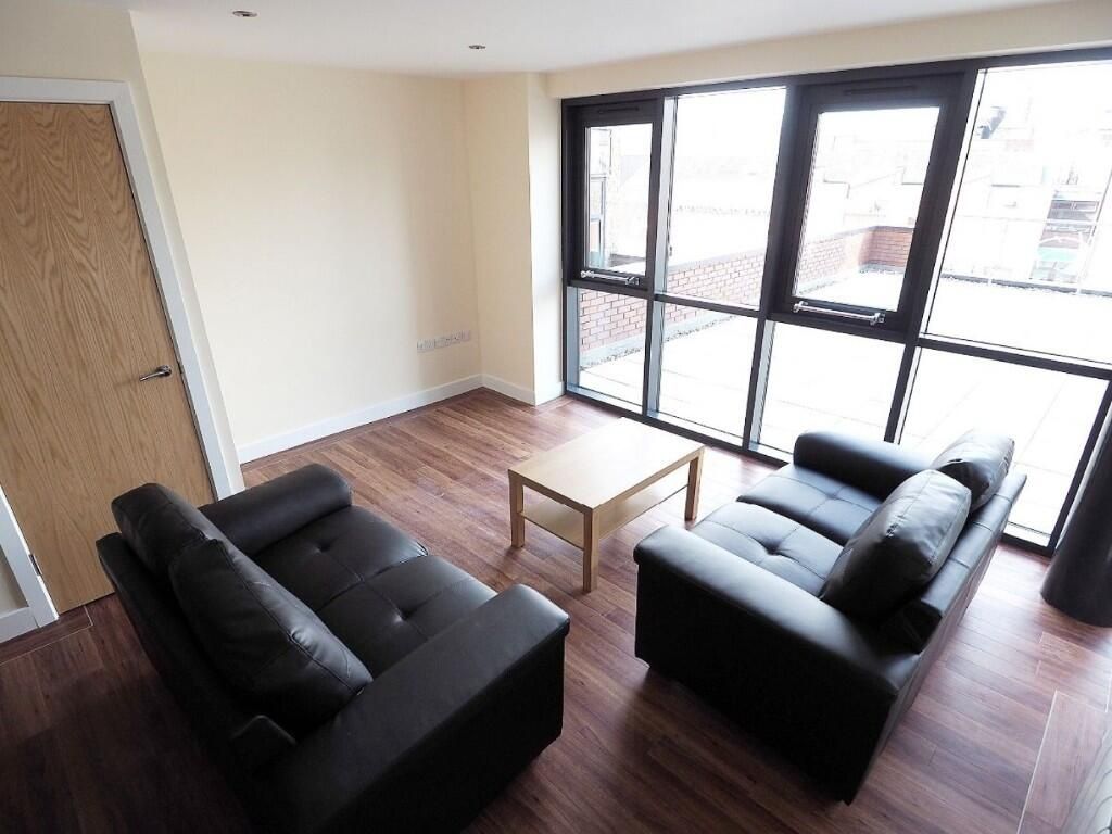 Property photo 2 of 10 Contemporary Living Room Featuring Large Floor-To-...